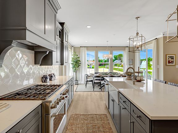 Kitchen with quartz island and countertops