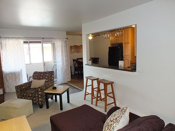 Living area to kitchen and porch.