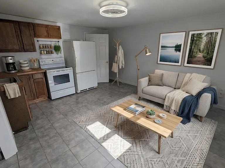 Living Room and Kitchen- this image is virtually staged to show room potential
