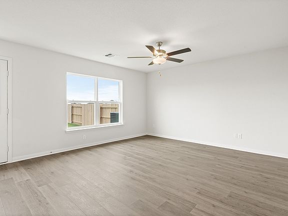 The family room is large and sits adjacent to the dining room and kitchen.