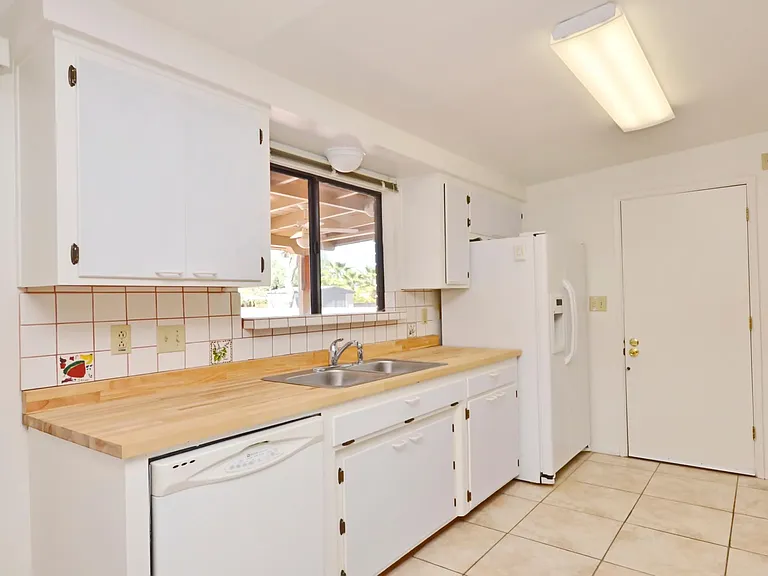 Galley Kitchen with entrance from carport