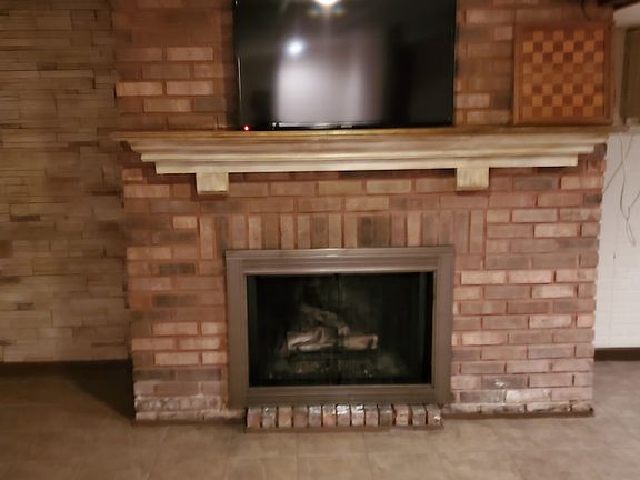 Finished basement with gas fireplace