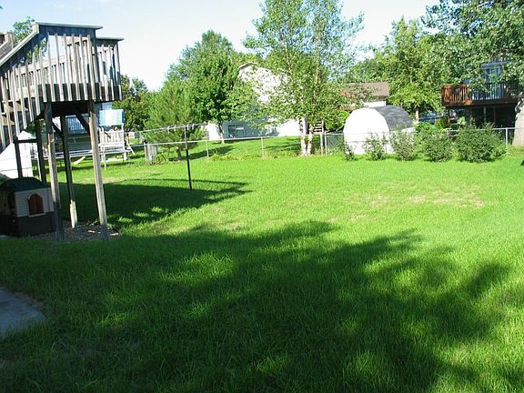 HUGE FENCED BACK YARD W/STORAGE SHED