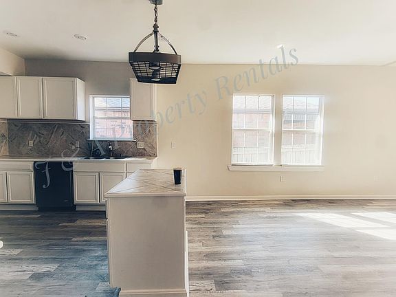 Kitchen, island, dinning area. P.s. Separate Laundry room is accessed through the kitchen