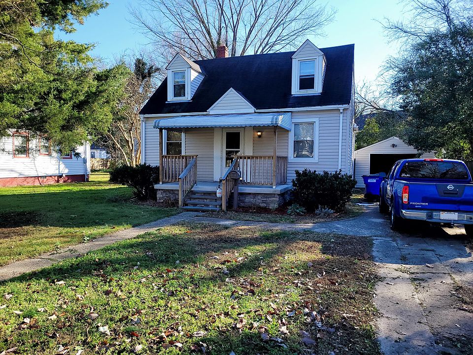 front of house, detached garage to the right.