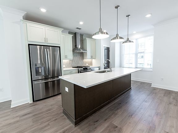Light Filled Kitchen with Stainless Steel Appliances