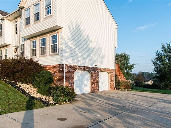 The home is nicely landscaped and offers a concrete sidewalk and driveway