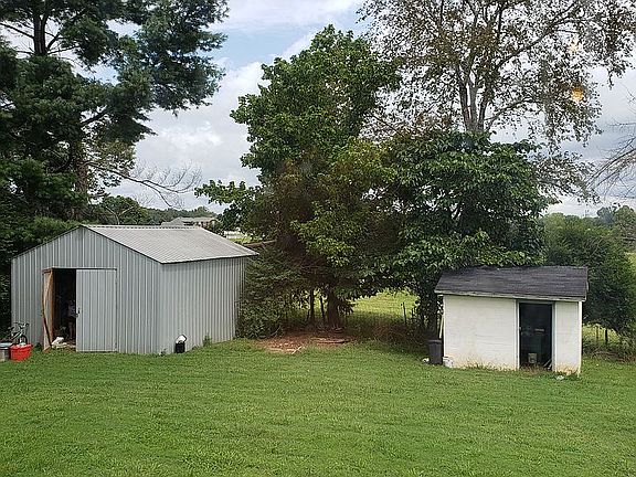 1 Concrete and 1 Pole Barn