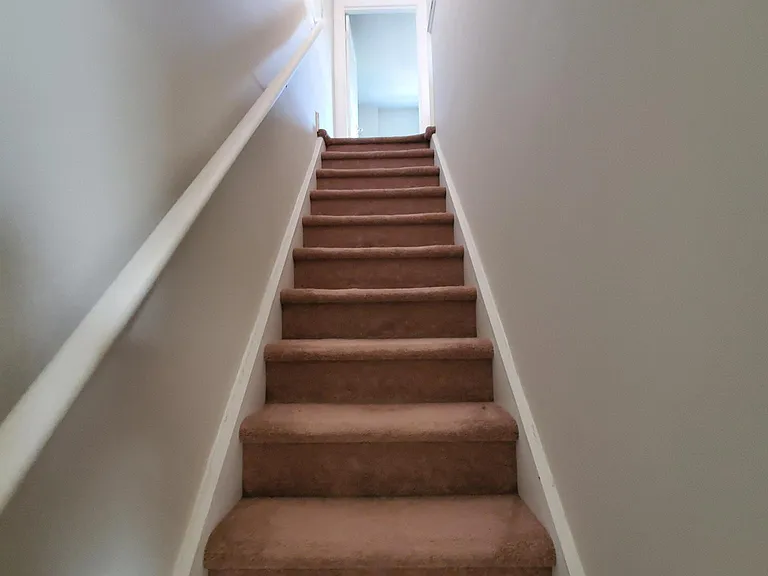 Stairs leading to third floor with Master Bedroom