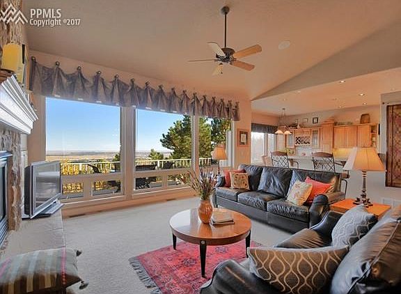 Great room has expansive views of the city and plains beyond