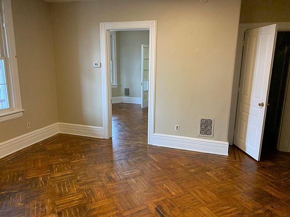 Living room into bedroom 1 and hallway