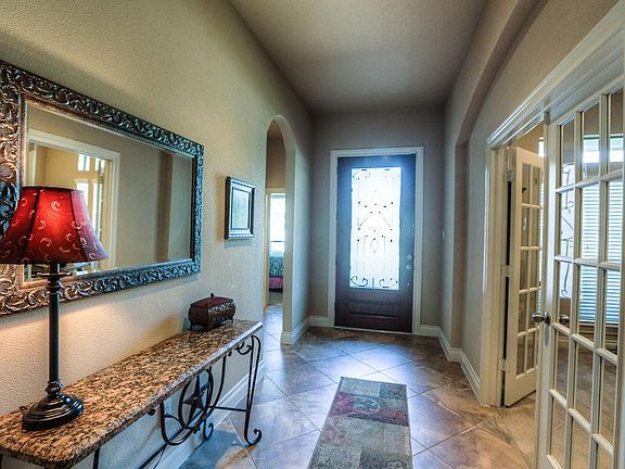 Mahogany lead door leading into the foyer with lots of natural light.