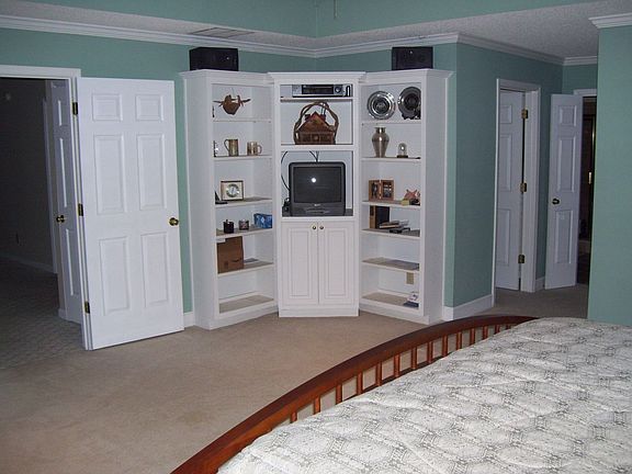 Master Bedroom with Built-in Book Shelves