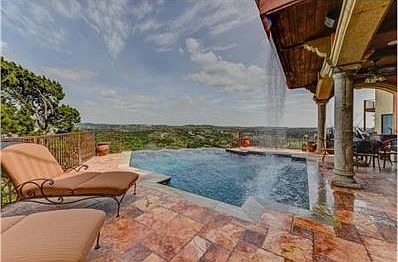 Pool has customized waterfall features