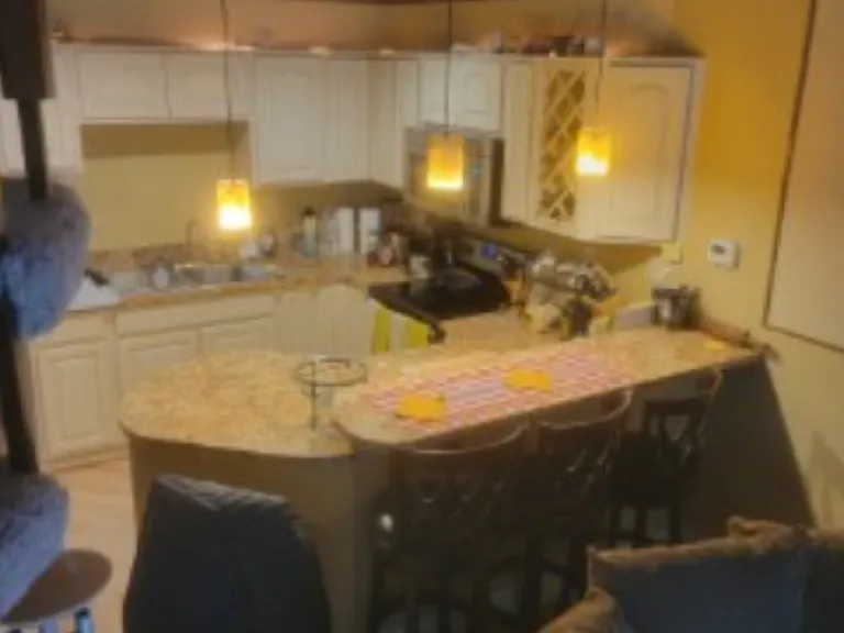Three tall and one short barstools included.
