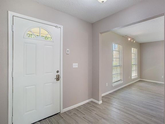 Open the door, and enter the light and bright entryway, with tons of natural light!