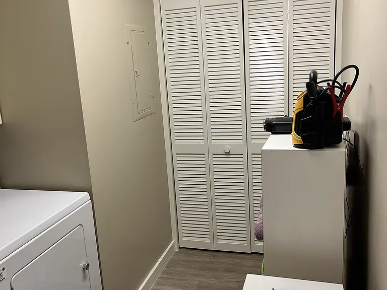 Large laundry room with en suite washer, dryer and plenty of storage.