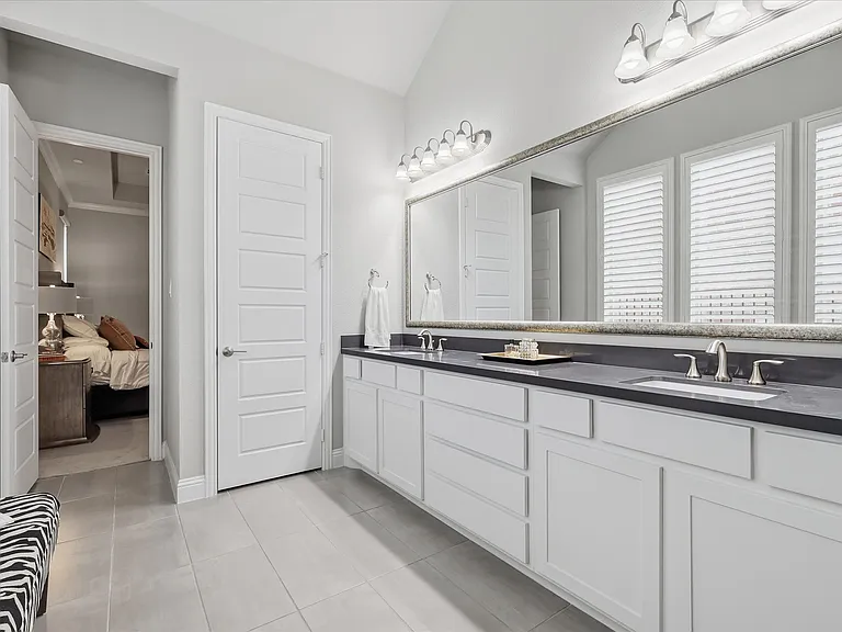 Indulge in luxury within this beautifully appointed primary bathroom, designed to provide a serene, spa-quality escape