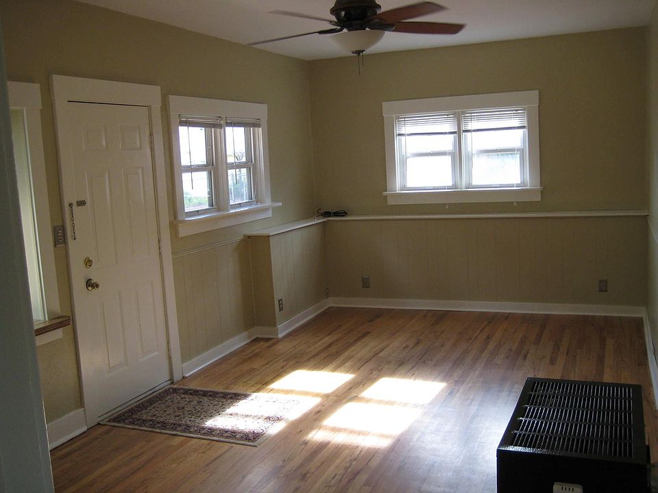 Front Door - Living room area - note black gas heater for the entire cottage.
