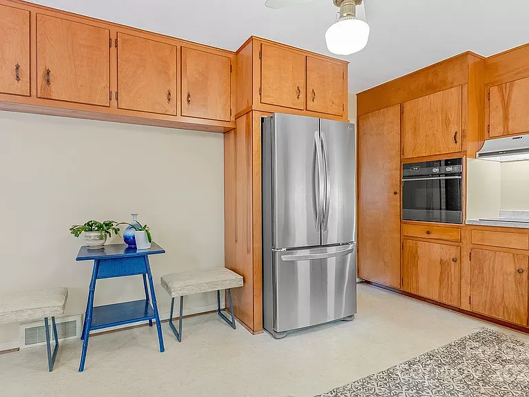 Kitchen before hutch, new hardware, and fan