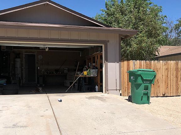 2 car garage has lots of shelving
