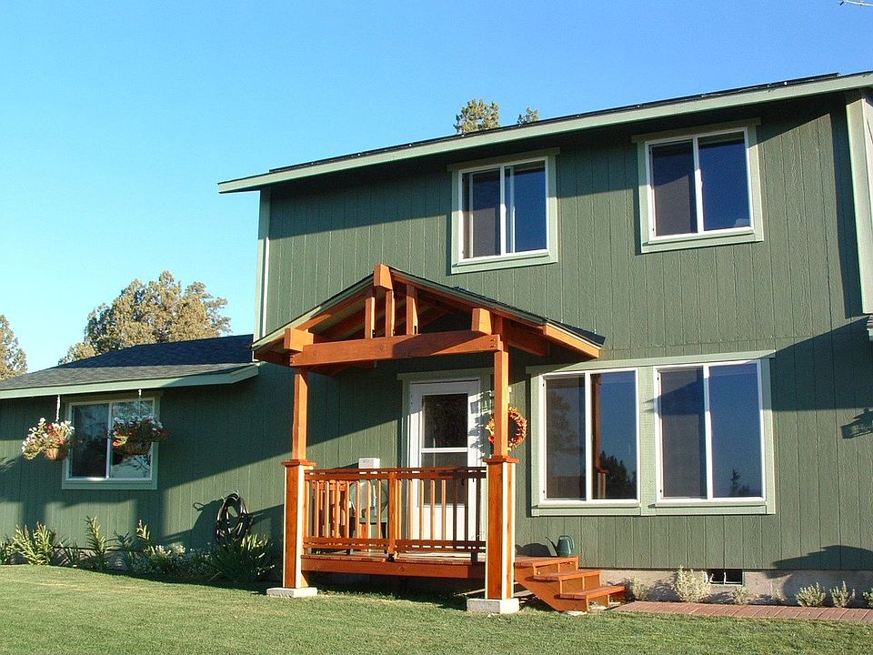 Front of home with new covered entry