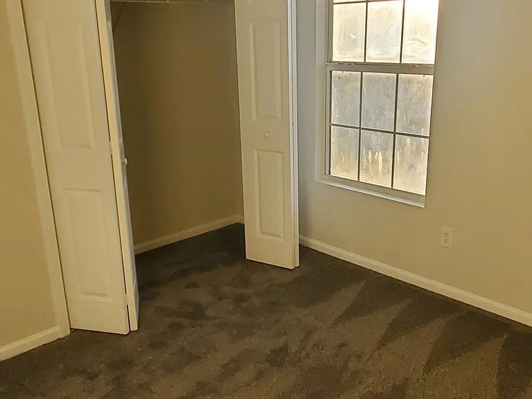 Bedroom #3 - Featuring Wall to Wall carpeting, ceiling fan and double door closet