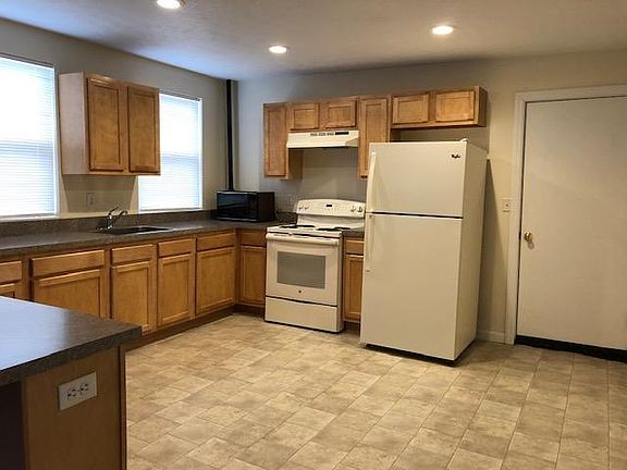 Kitchen with stove and refrigerator.