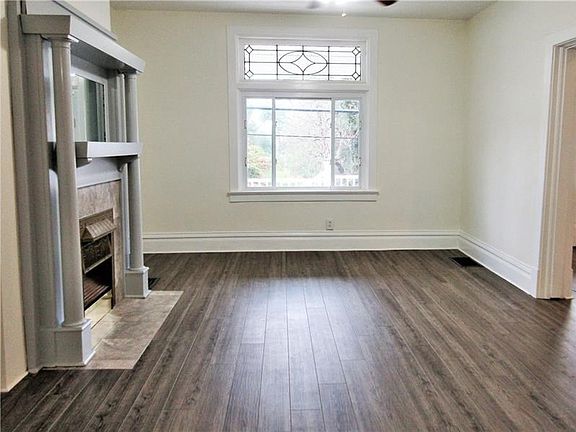 With a large picture window and gleaming new vinyl flooring, you'll want to spend all of your time in this beautiful living room