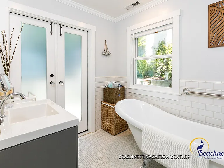 Beautifully updated bathroom with claw foot bath tub and stall shower.