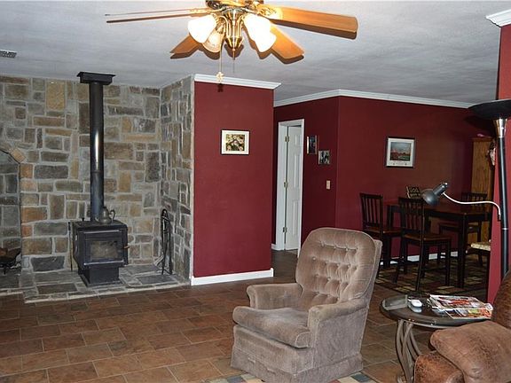 Wood stove with built in area to store firewood