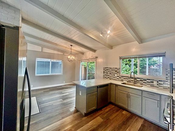 Kitchen and dining area with slider to back yard.