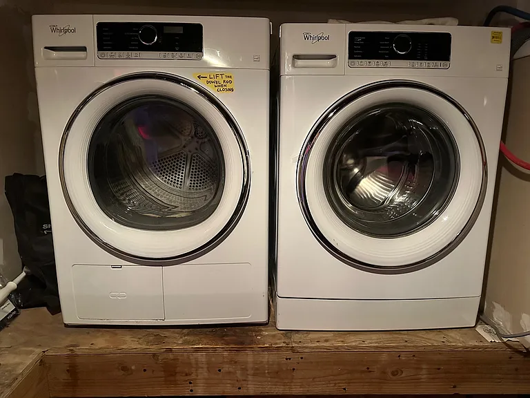 High efficiency washer and dryer in laundry room.