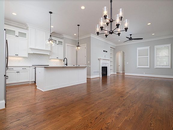 Open floor plan with natural hardwood floors are throughout the home