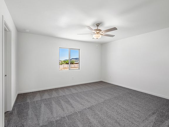 The master suite has beautiful windows that provide natural lighting