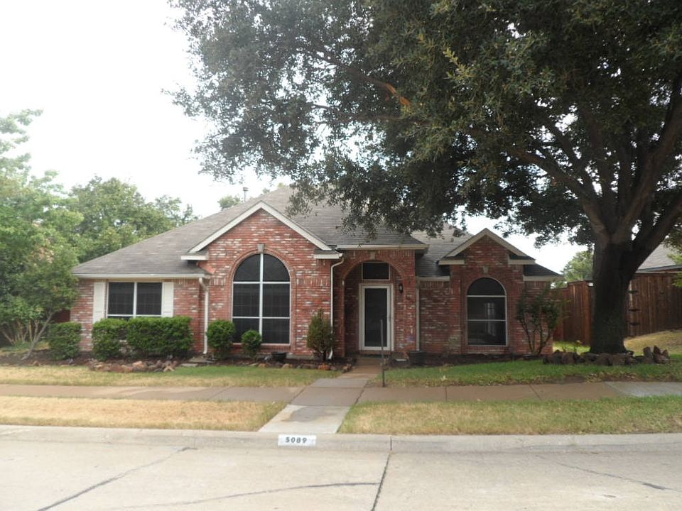 Front with large tree provides excellent solar shade.