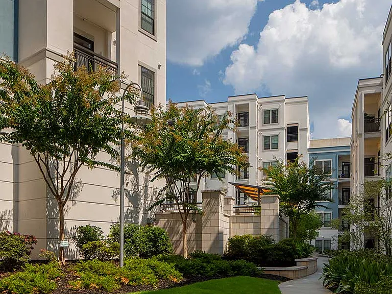Community building with walkway amongst landscaping