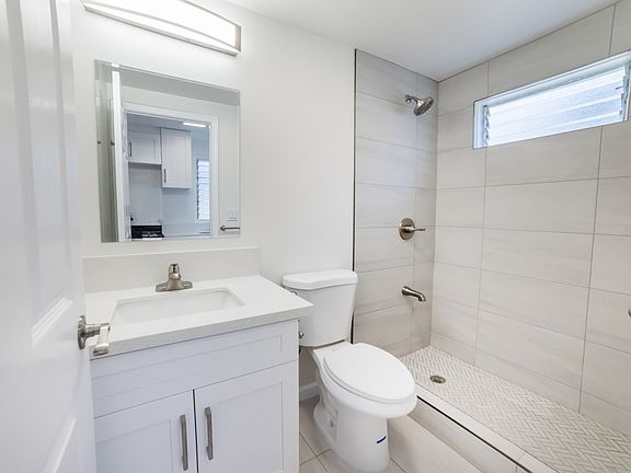bathroom with tiles shower