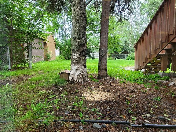 View from side gate of backyard, fully fenced