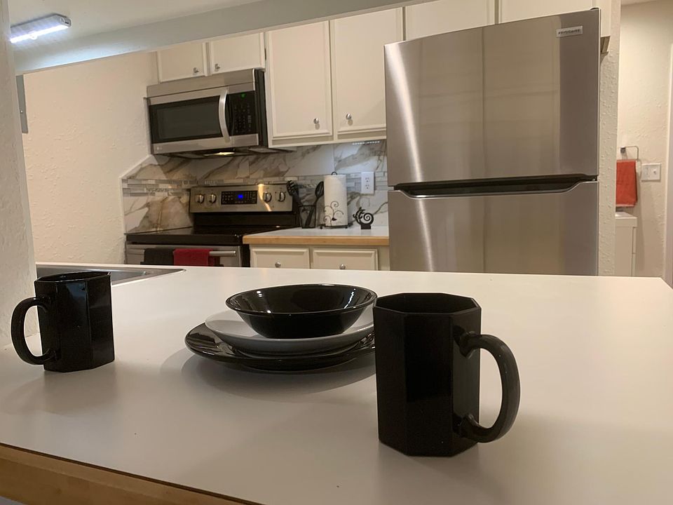 Kitchen with a BREAKFAST BAR and PANTRY