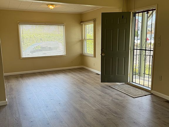 More views of living space - ceiling fan, and beautiful new windows