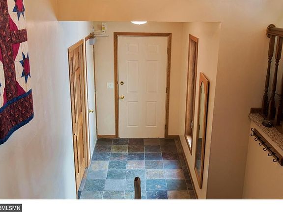 Large main entry w/new slate tile flooring and newer window. Entry door form garage is remote open/close - HC Accessible.