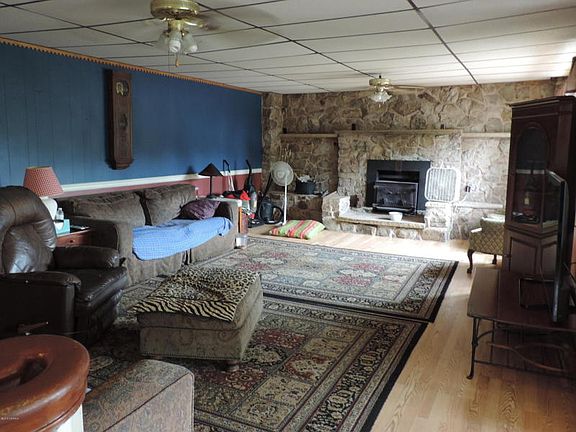 Living Room with Stone Wall and Fireplace