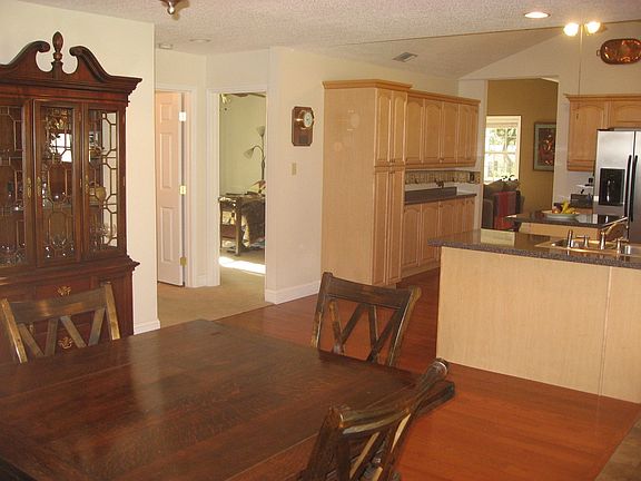 Dining and kitchen with hall to bedrooms