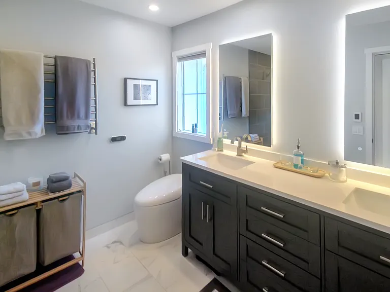 Master Bath, fully renovated with high end features. Thermostatic multi-head shower, towel warmer, heated floors, japanese-style bidet toilet, no-fog mirrors, hidden storage.