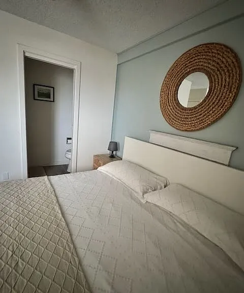 Primary bedroom has private en suite half bath.