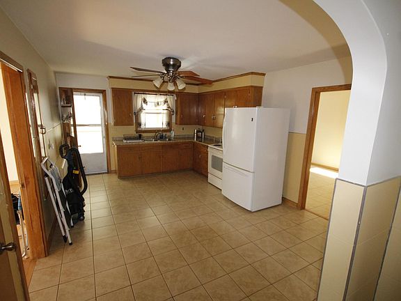 Large centrally located kitchen leads out onto a carpeted "fully" closed in porch. Fridge is brand new!