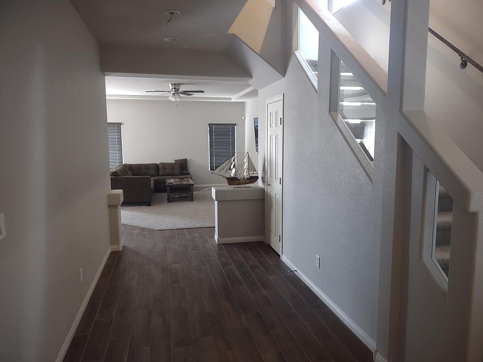 As you walk inside the front door You are faced with a long hallway Garage door from inside on the left and small 1/2 bathroom for guests on the right. Right before the beginning of the family room There is a very large closet (under the stairs) for stora