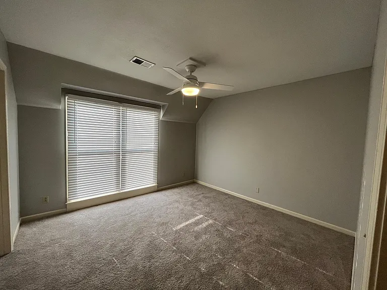 View of 2nd bedroom offering ceiling fan