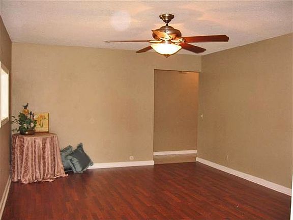 Large family room with wood laminate flooring